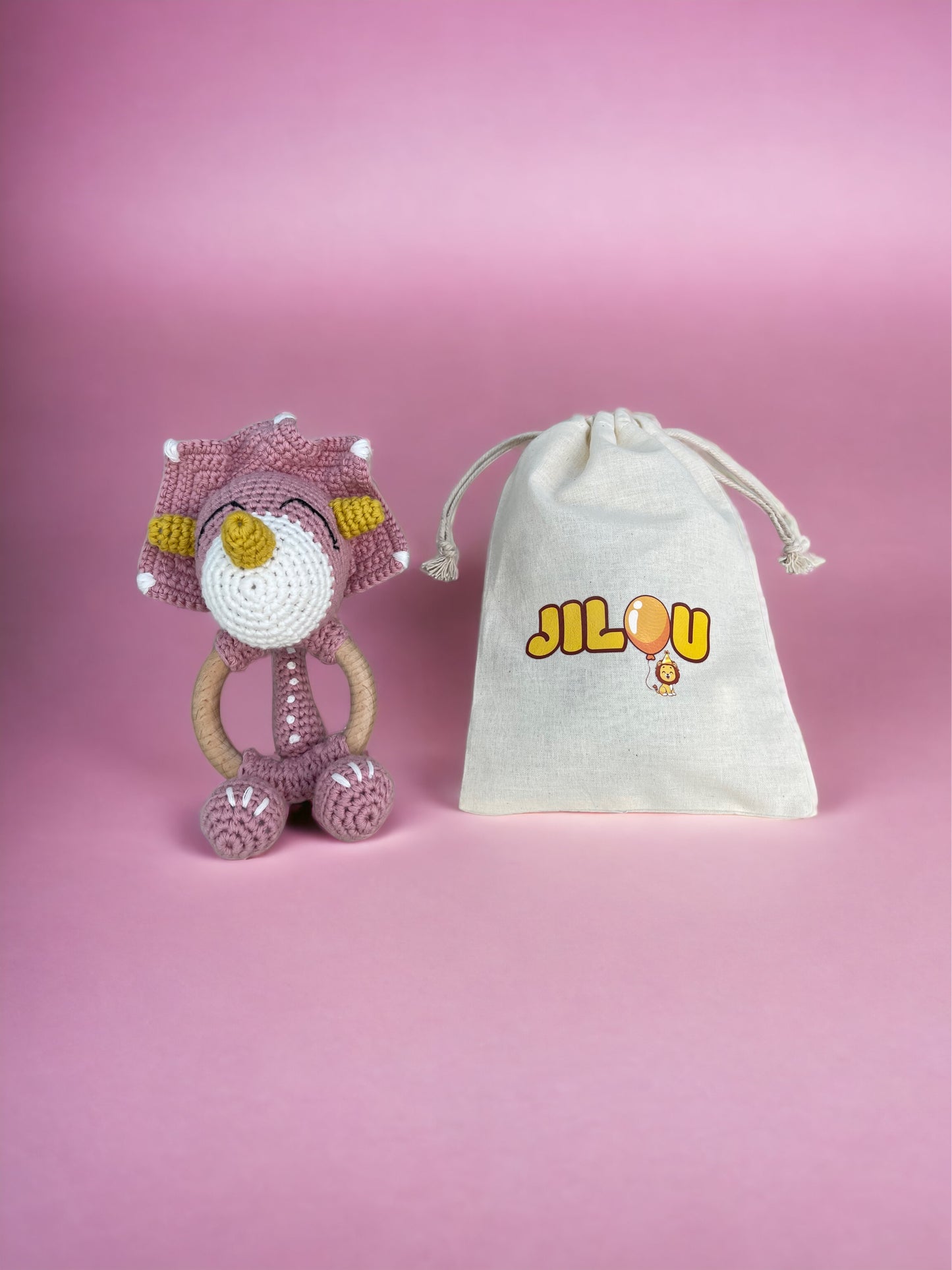 Gehäkelte Rassel - rosa Dino